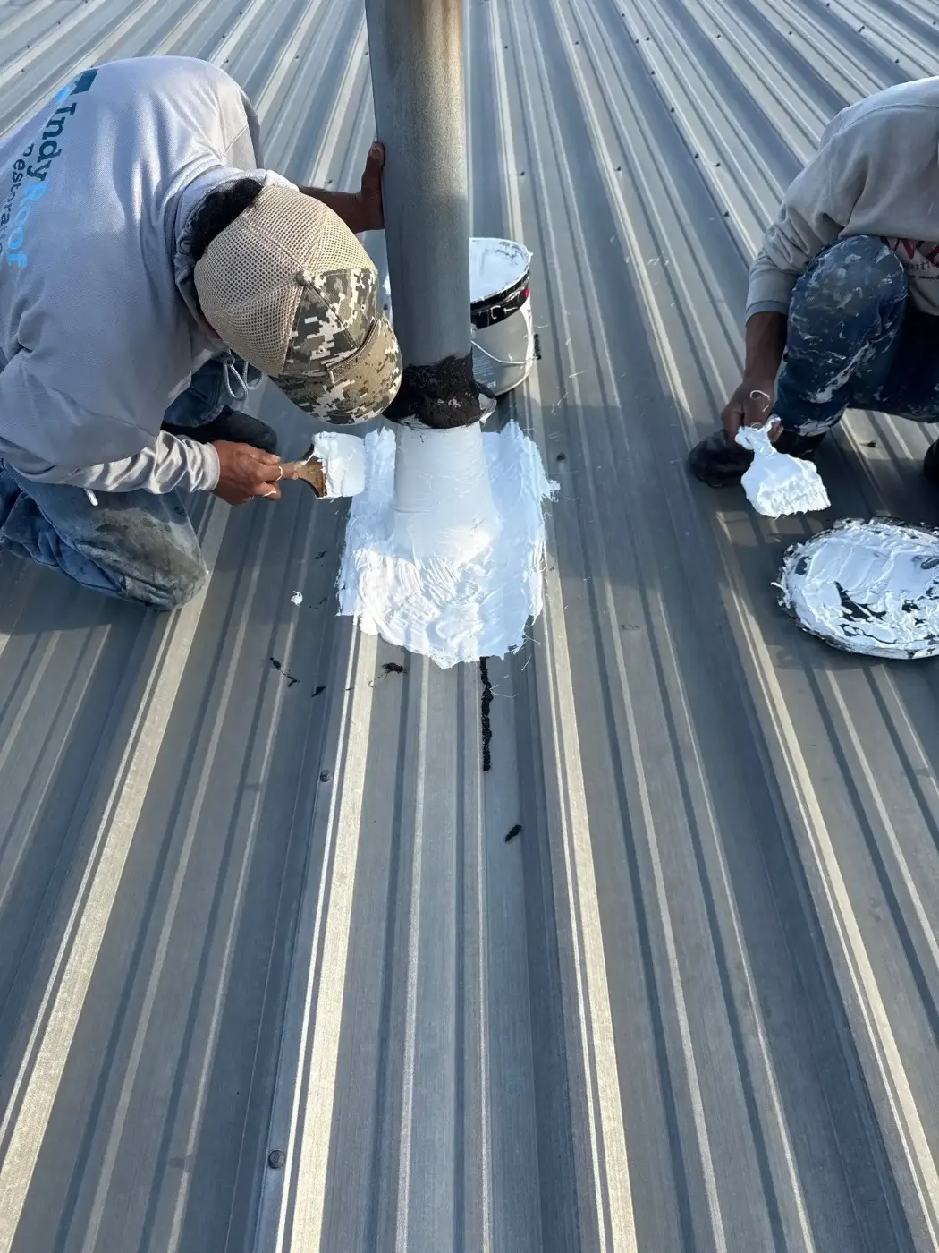 Tarping and dry-in on a Imperial Hills commercial roof